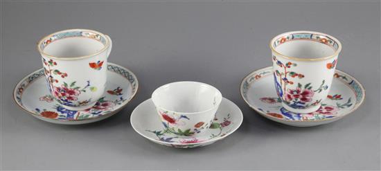 A pair of chocolate cups and saucers and a similar teabowl and saucer